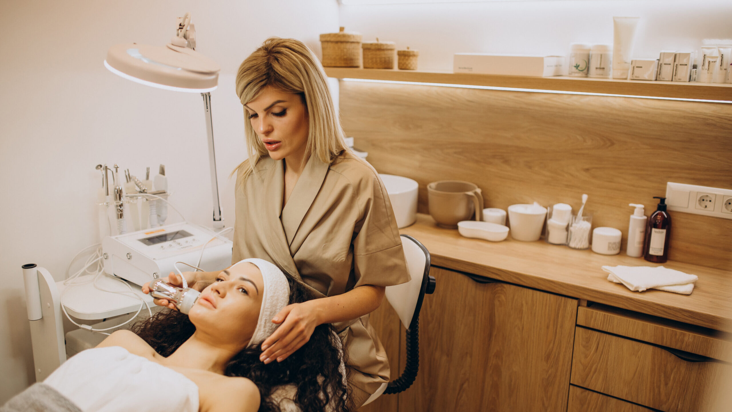 Woman at cosmetologist making beauty procedures